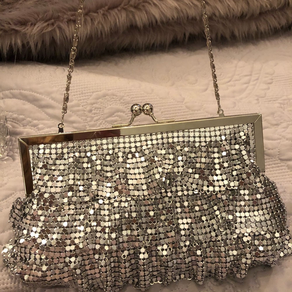 New with tag, silver sparkle clutch with strap